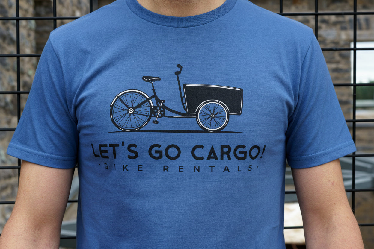 Person wearing a blue t-shirt with a Let's Go Cargo! graphic.